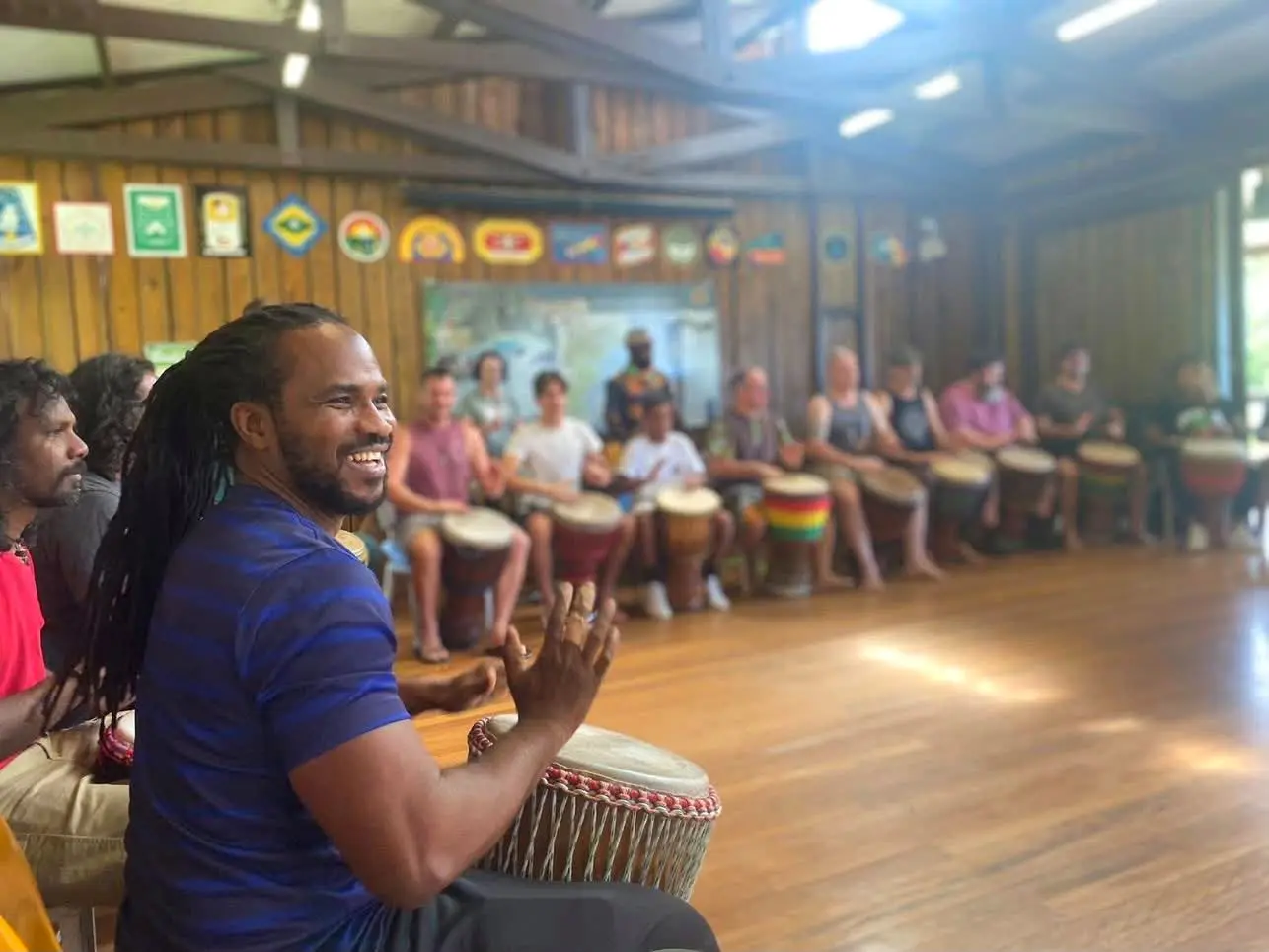 Sibo teaching a drumming circle