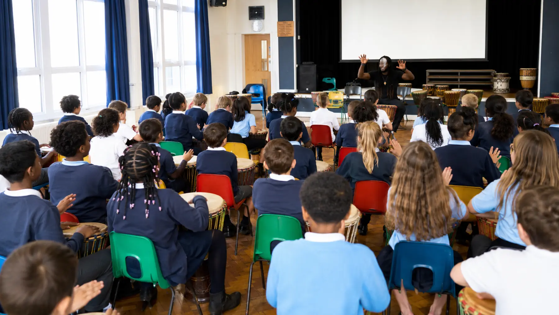 School incursion, a hall full of students drumming